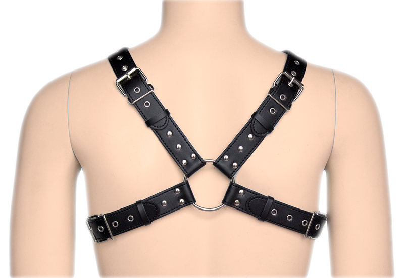 Made out of vegan leather, this harness crosses over the chest, joined by a metal ring on the front